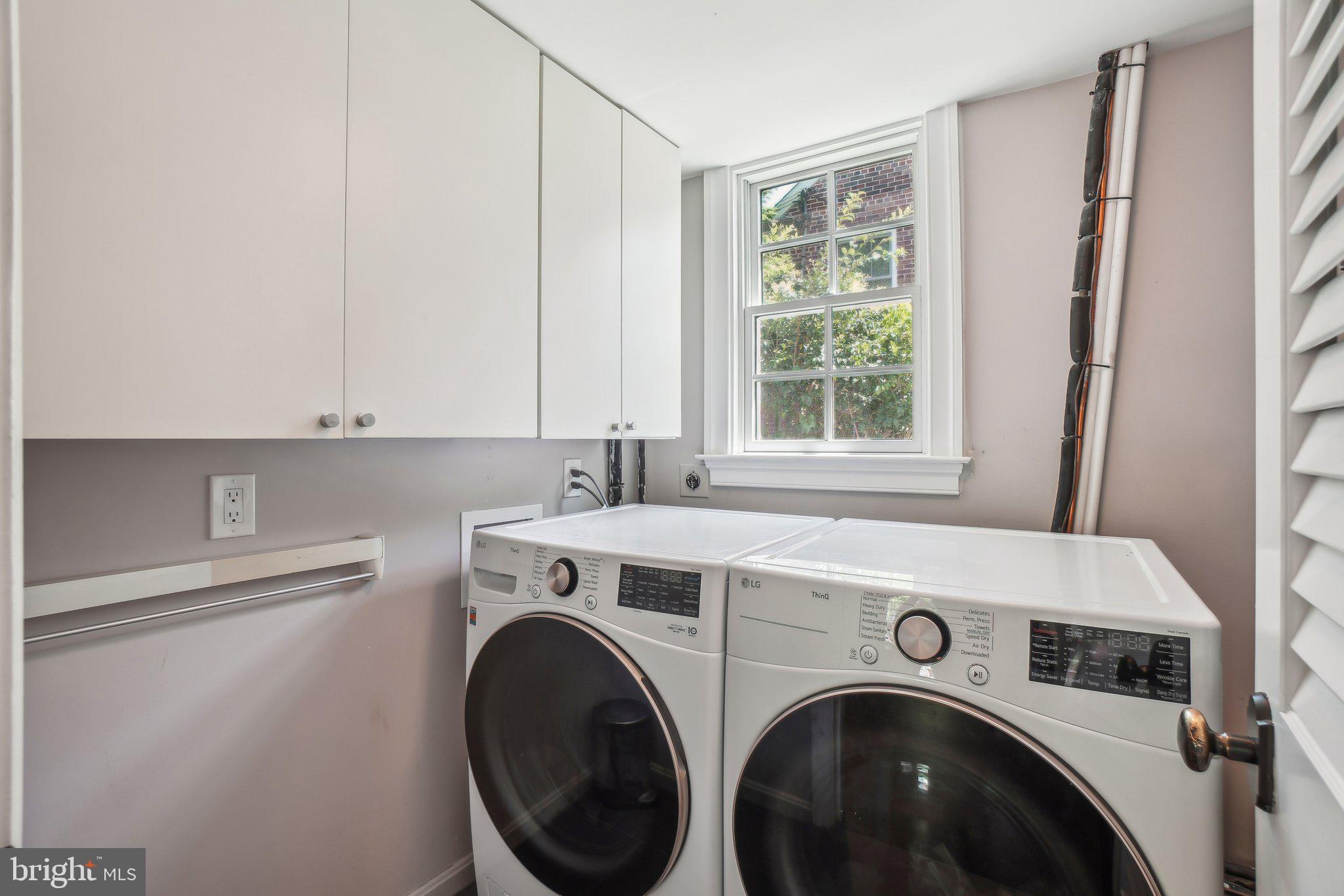3626 Brandywine Street Northwest Washington, DC 20008 - Photo 14 of 42 a view of washer and dryer with kitchen in the background