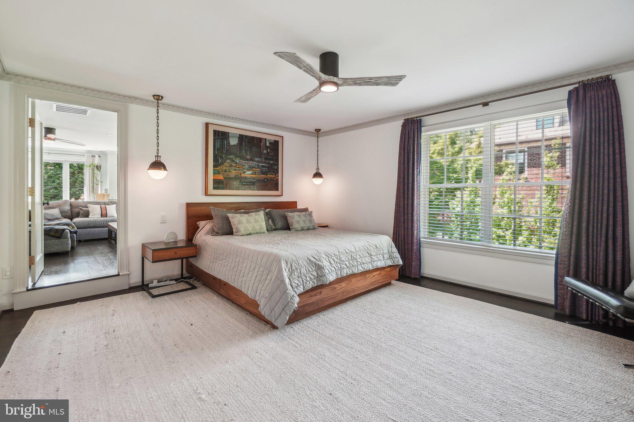 3626 Brandywine Street Northwest Washington, DC 20008 - Photo 20 of 42 a bedroom with a large bed and a window