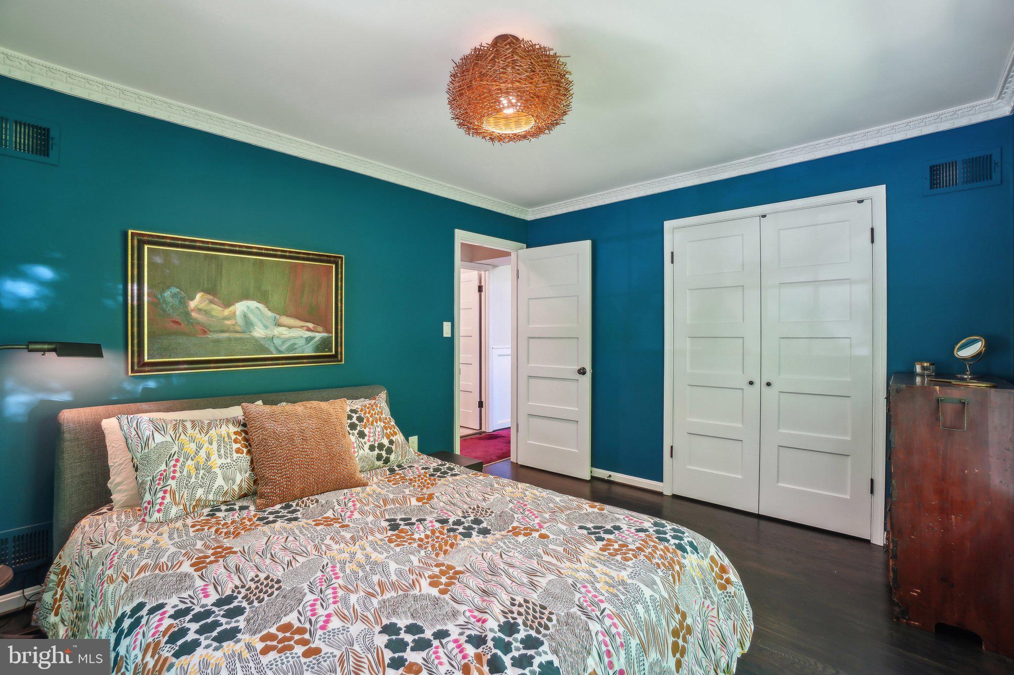 3626 Brandywine Street Northwest Washington, DC 20008 - Photo 25 of 42 a bedroom with a bed and a painting on the wall