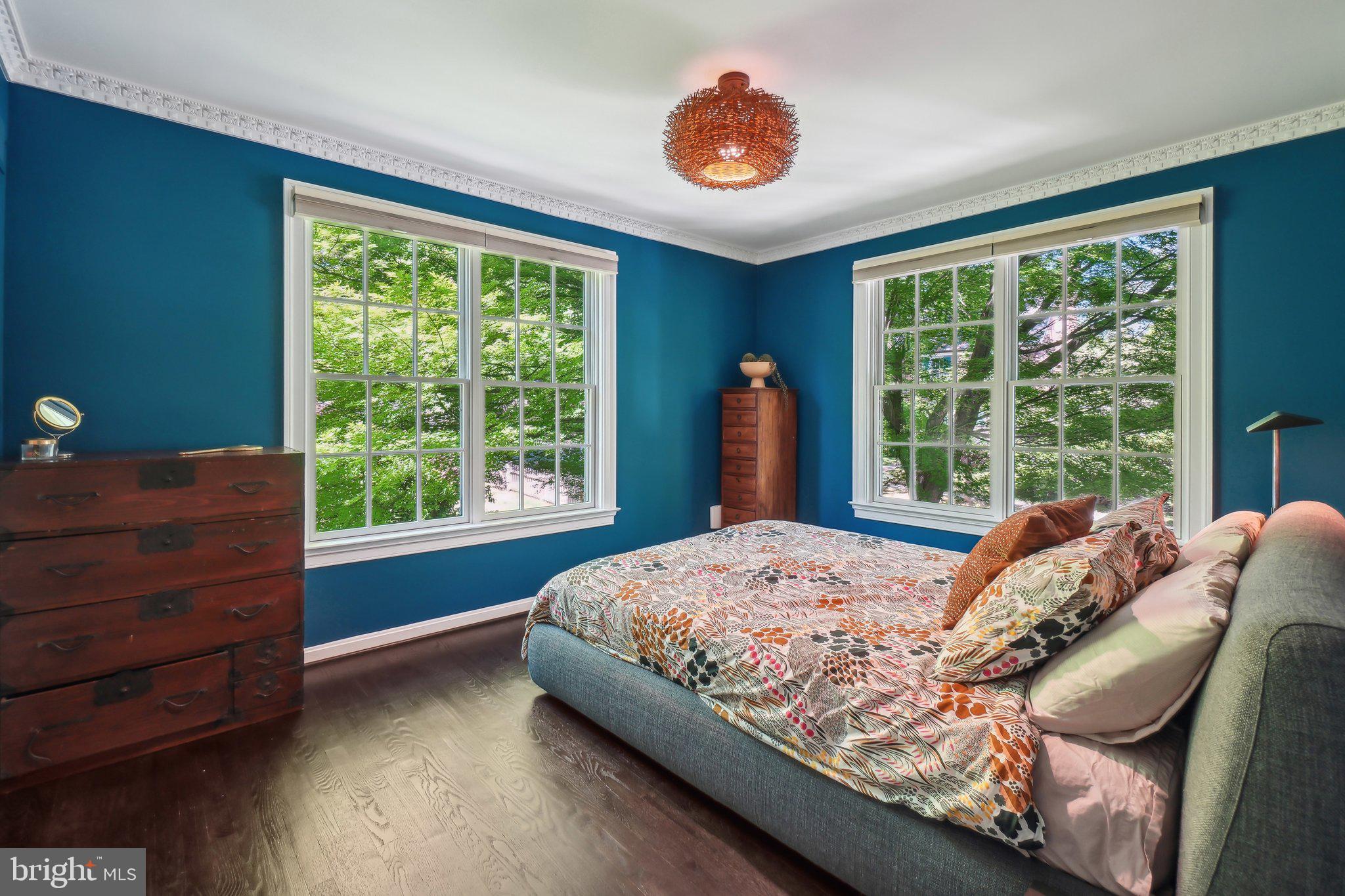 3626 Brandywine Street Northwest Washington, DC 20008 - Photo 26 of 42 a bed sitting in a bedroom next to a window