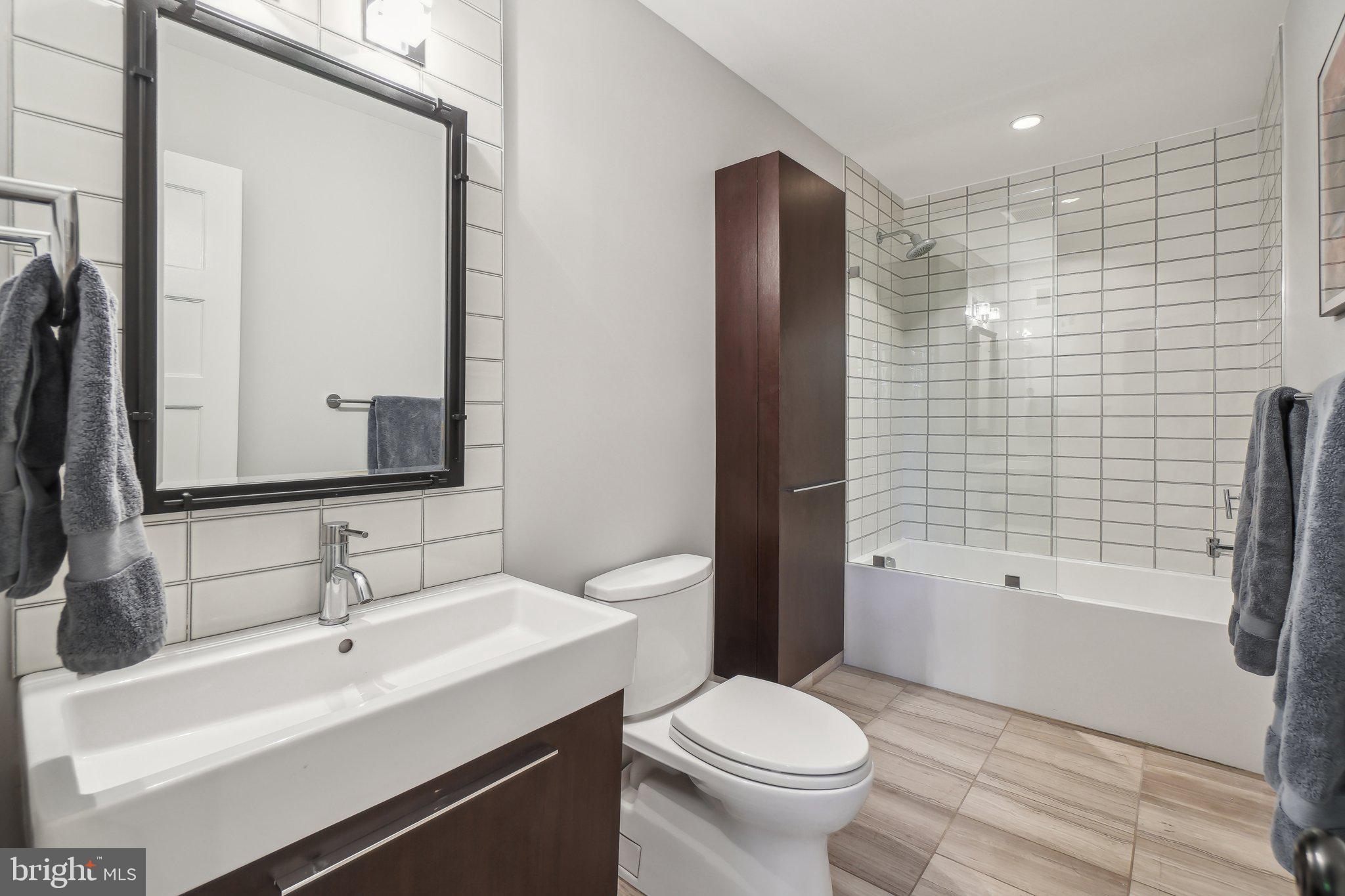 3626 Brandywine Street Northwest Washington, DC 20008 - Photo 28 of 42 a bathroom with a sink toilet and shower