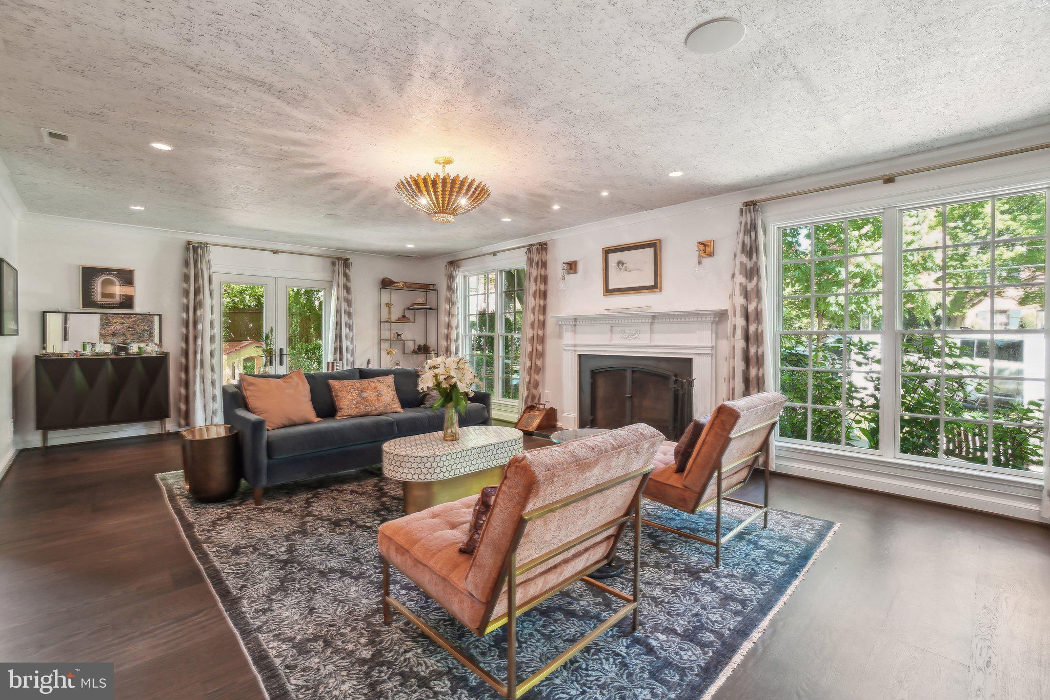 3626 Brandywine Street Northwest Washington, DC 20008 - Photo 3 of 42 a living room with furniture and a fireplace