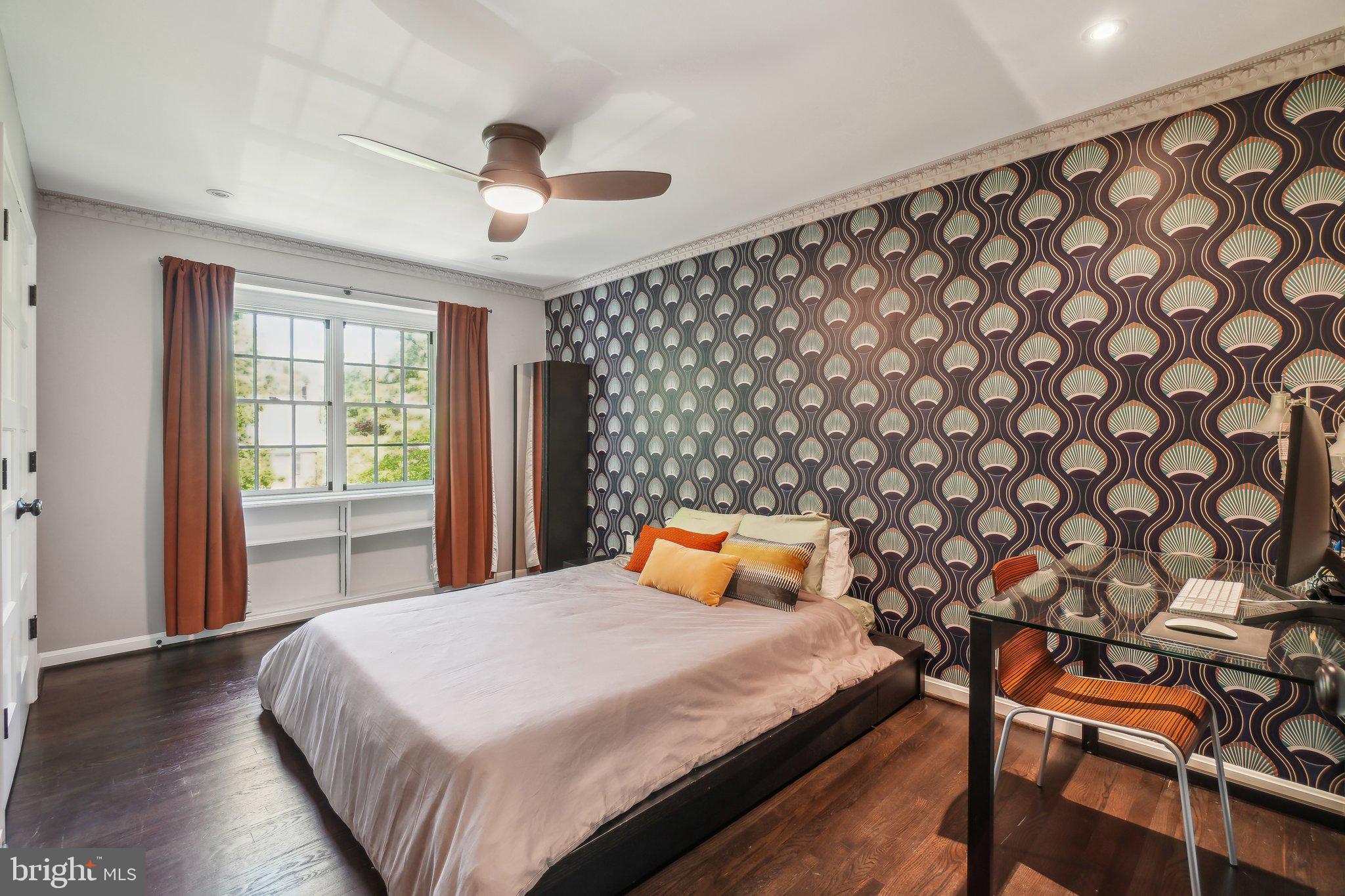 3626 Brandywine Street Northwest Washington, DC 20008 - Photo 31 of 42 a bedroom with a bed and wooden floor