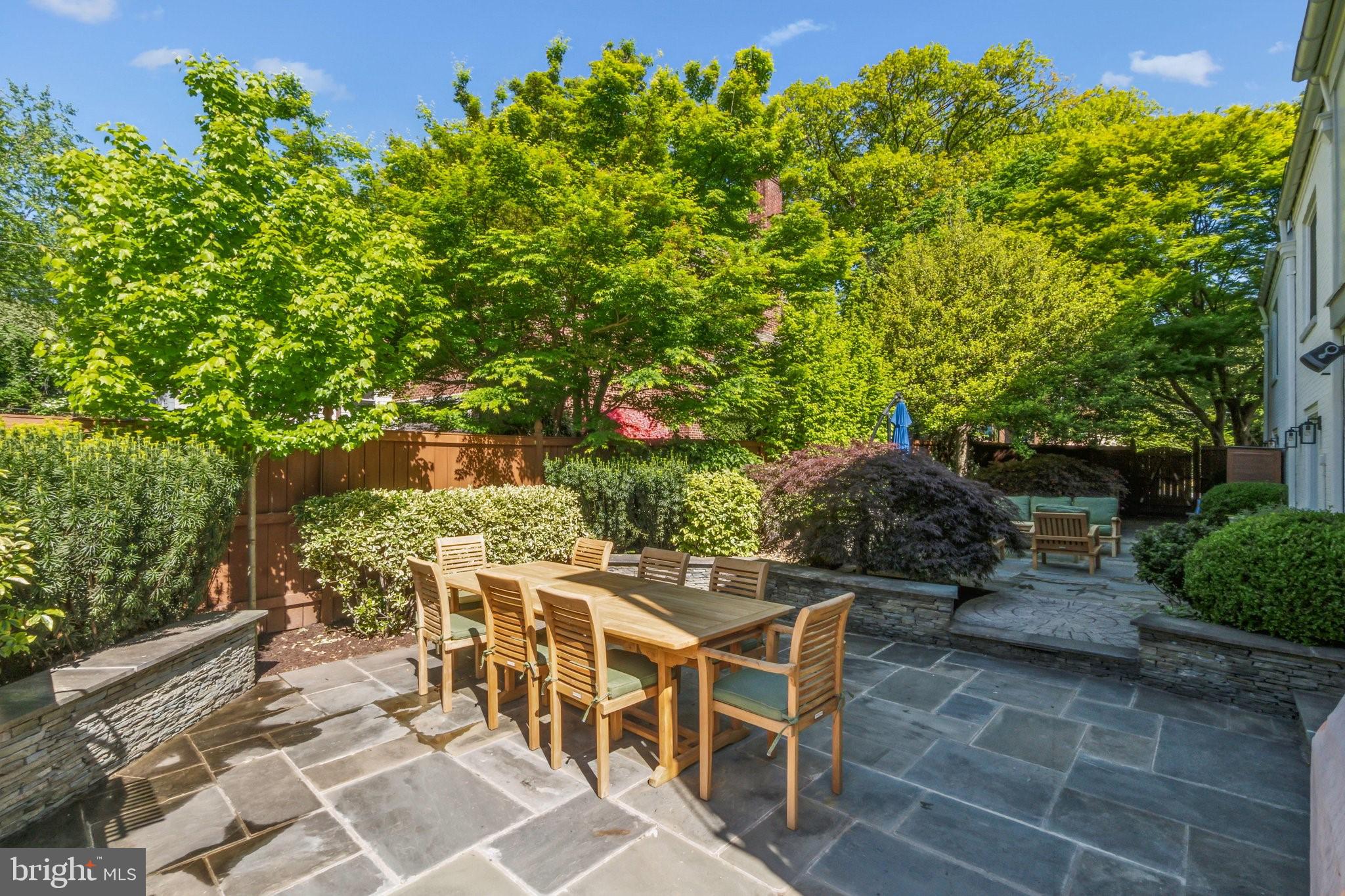 3626 Brandywine Street Northwest Washington, DC 20008 - Photo 36 of 42 a patio with table and chairs and potted plants