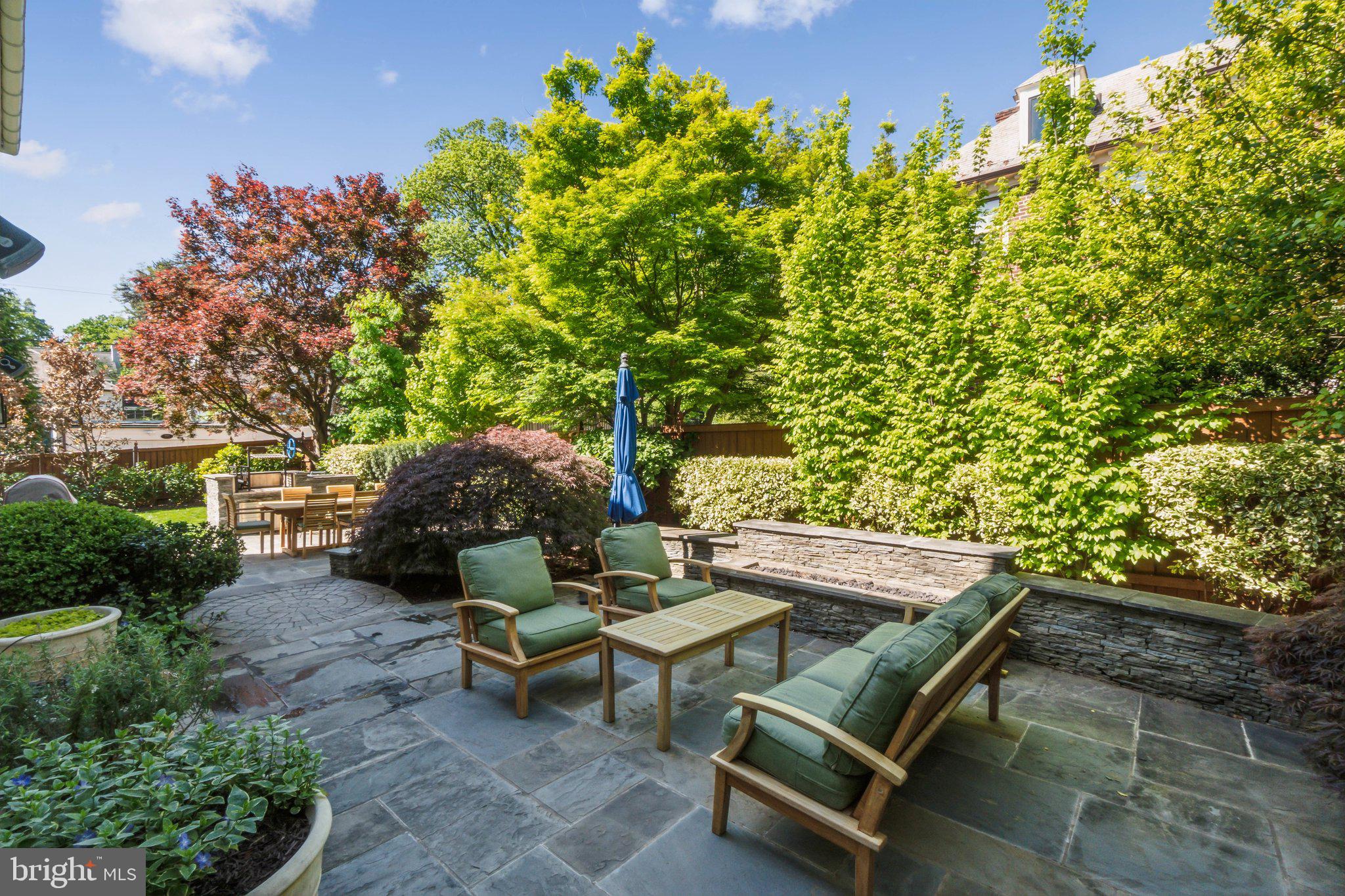 3626 Brandywine Street Northwest Washington, DC 20008 - Photo 38 of 42 a backyard of a house with table and chairs