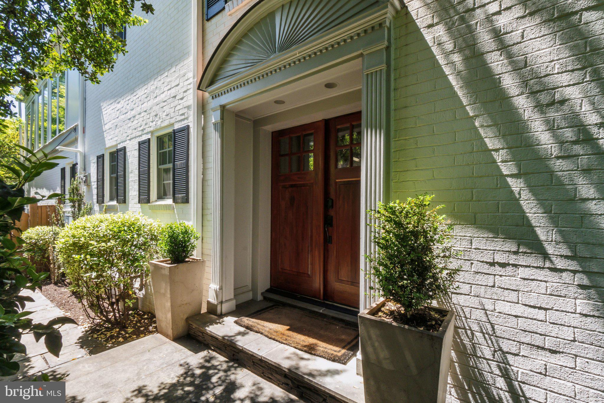 3626 Brandywine Street Northwest Washington, DC 20008 - Photo 40 of 42 a couple of potted plants in front of door