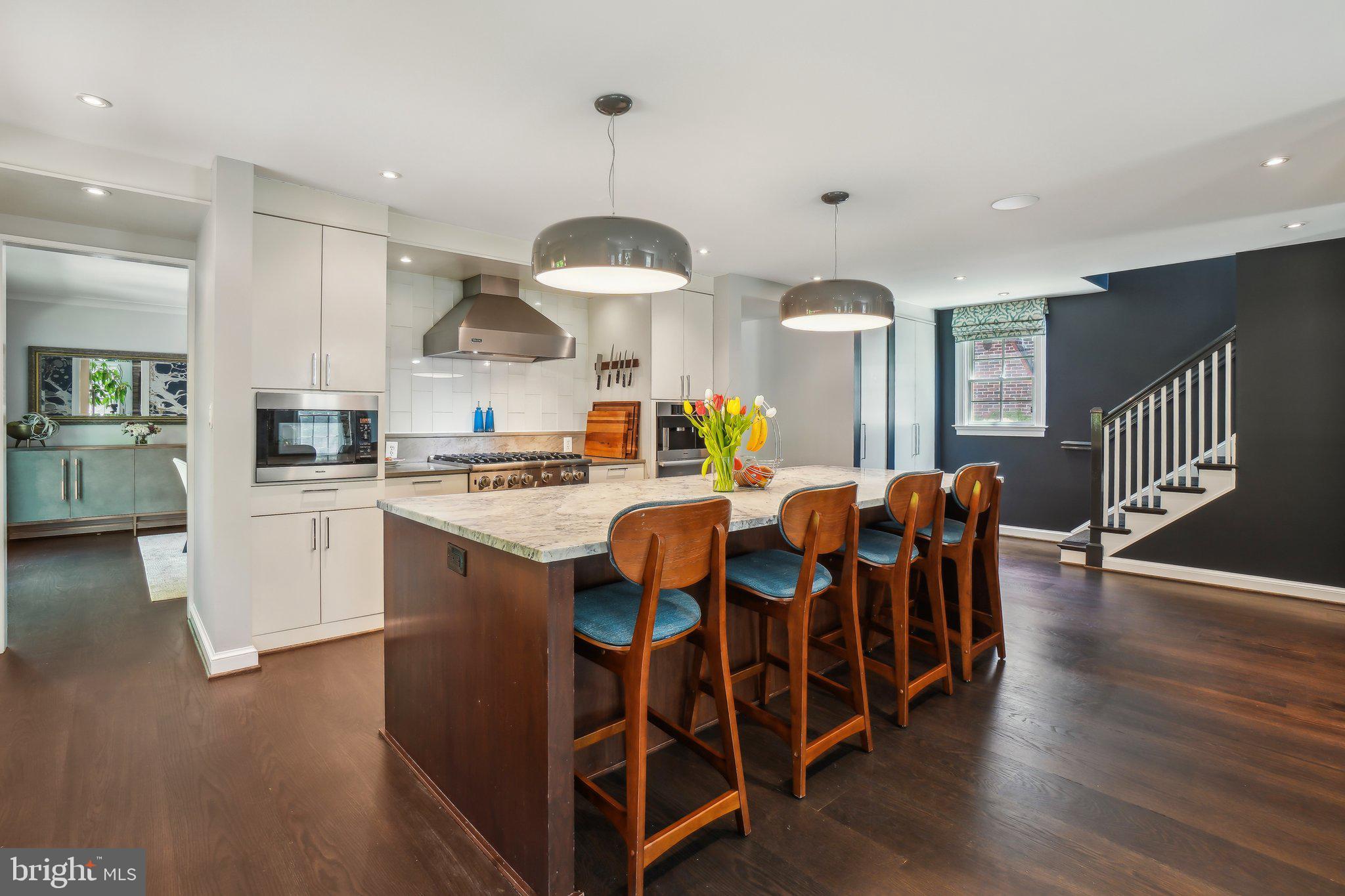 3626 Brandywine Street Northwest Washington, DC 20008 - Photo 8 of 42 a large kitchen with a table and chairs