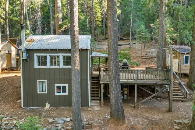 a view of a house with a porch and furniture