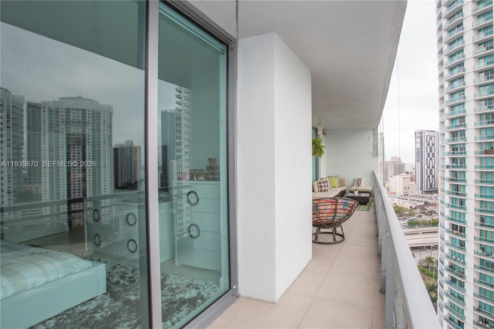 90 Southwest 3rd Street, Unit 2402 Miami, FL 33130 - Photo 25 of 28 a balcony with a walk in closet and bathroom