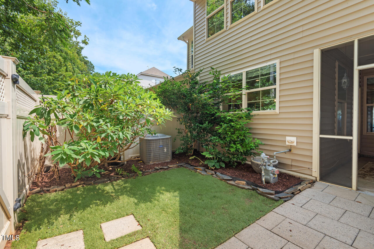 26 Intuition Circle Durham, NC 27705 - Photo 19 of 42 a view of a backyard with plants and a patio