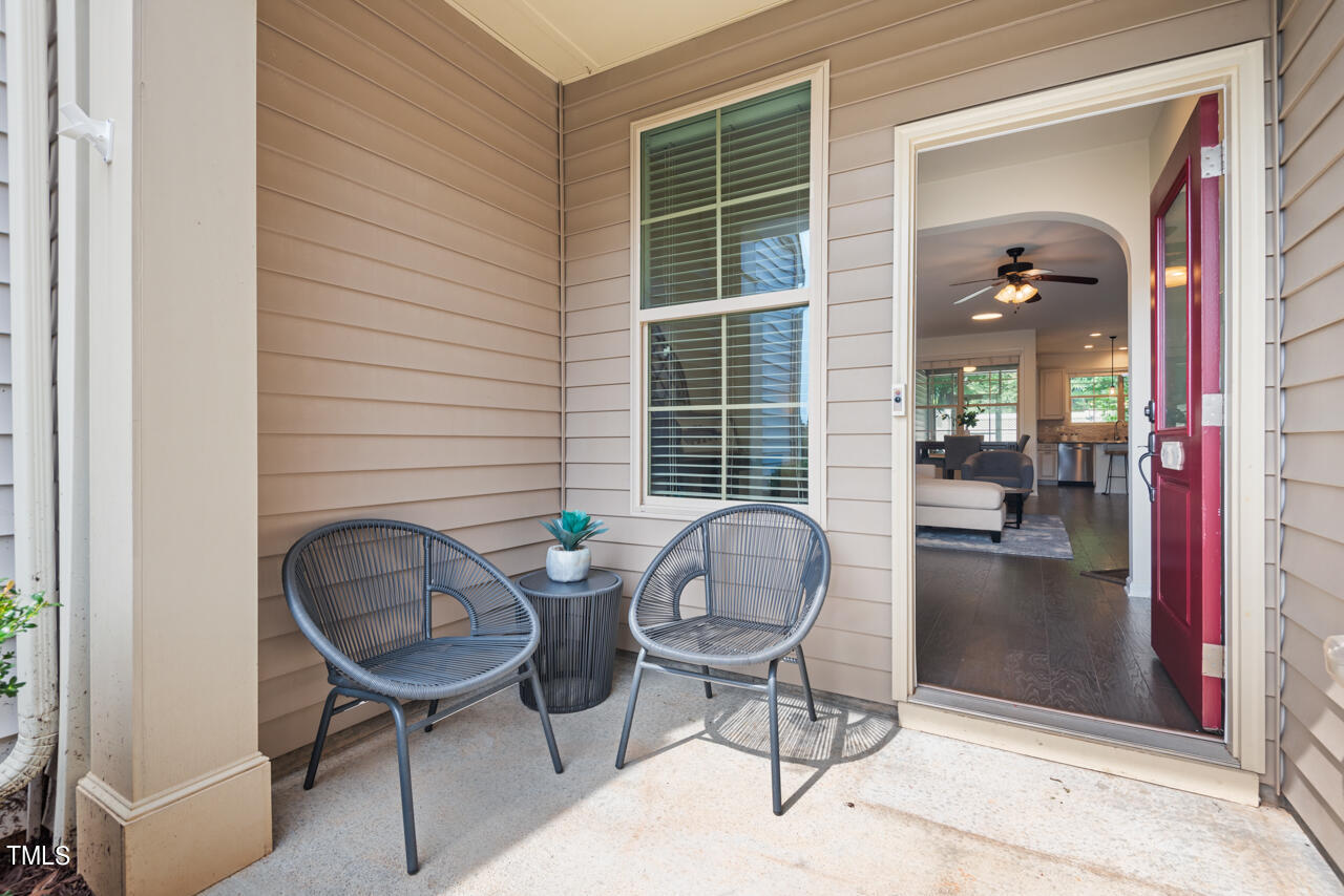 26 Intuition Circle Durham, NC 27705 - Photo 2 of 42 a backyard of a house with dining table and chairs