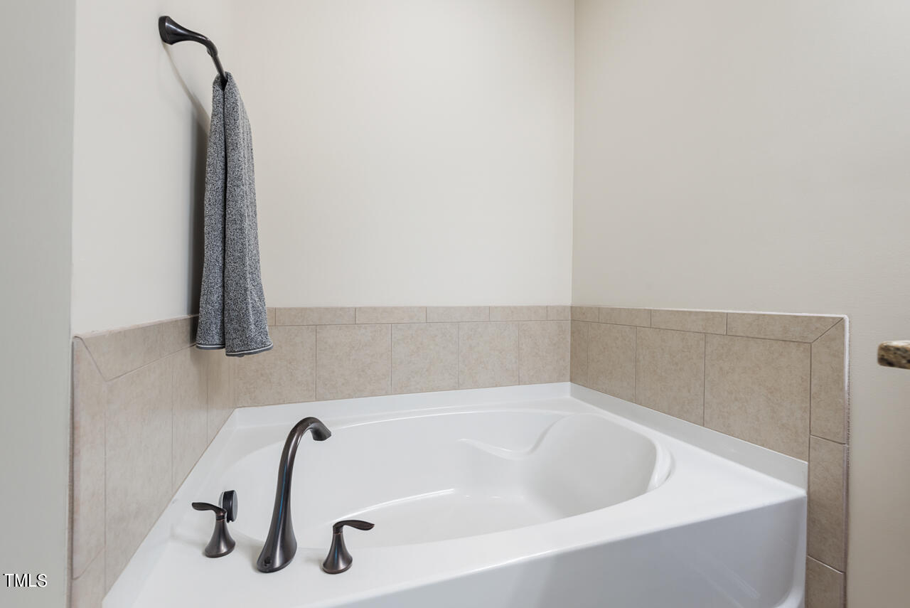 26 Intuition Circle Durham, NC 27705 - Photo 26 of 42 a bathroom with a tub