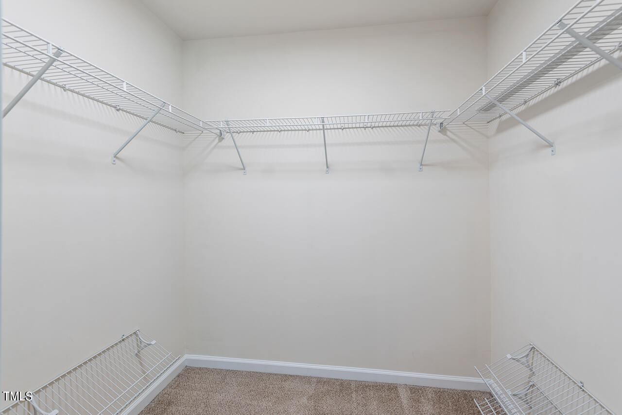 26 Intuition Circle Durham, NC 27705 - Photo 27 of 42 a view of a room with racks on the wall