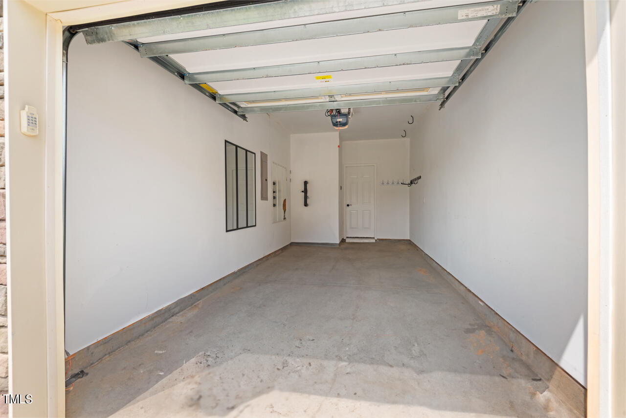 26 Intuition Circle Durham, NC 27705 - Photo 34 of 42 a view of a hallway with a white walls