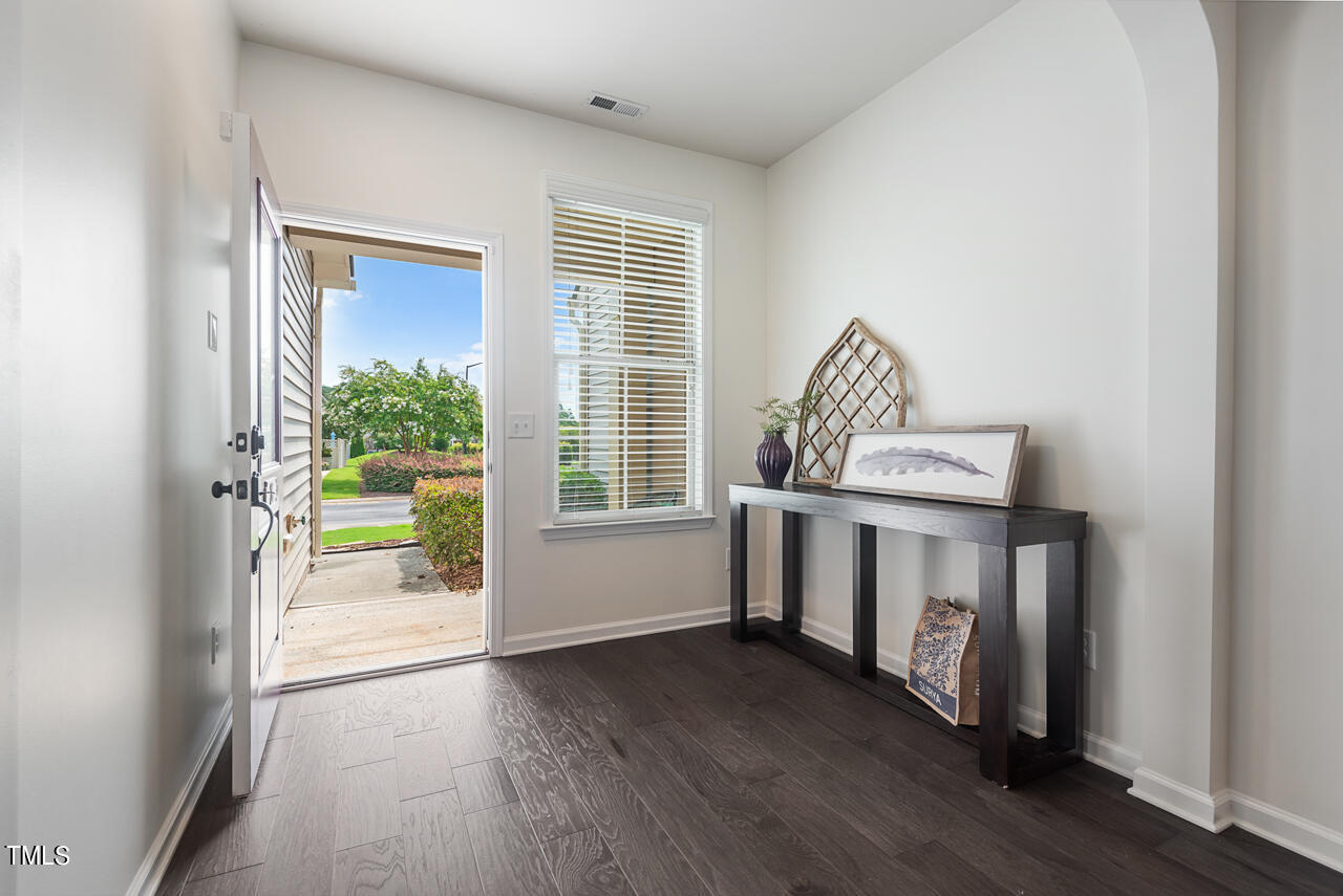 26 Intuition Circle Durham, NC 27705 - Photo 4 of 42 a view of livingroom with furniture and wooden floor