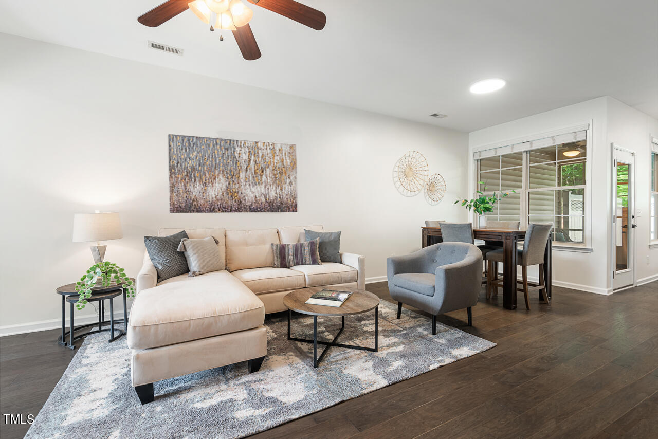 26 Intuition Circle Durham, NC 27705 - Photo 6 of 42 a living room with furniture wooden floor and chandelier