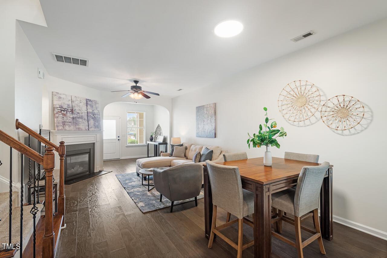 26 Intuition Circle Durham, NC 27705 - Photo 8 of 42 a view of a dining room with furniture window and wooden floor