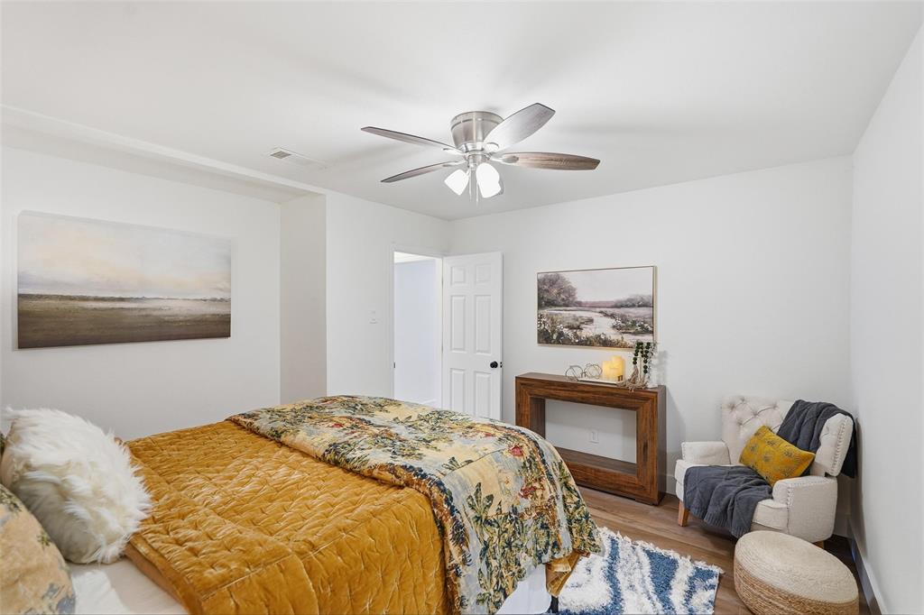 9938 John Flowers Road Wills Point, TX 75169 - Photo 13 of 40 Primary bedroom featuring wood finished floors and a ceiling fan
