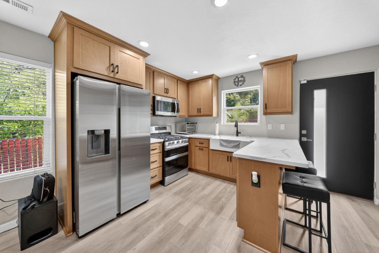 919 Old Canyon Road Fremont, CA 94536 - Photo 33 of 55 a kitchen with stainless steel appliances granite countertop a refrigerator a sink a stove and island