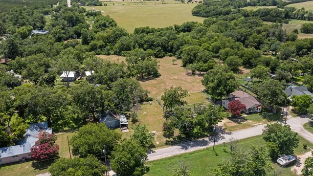 an aerial view of residential house with outdoor space and swimming pool