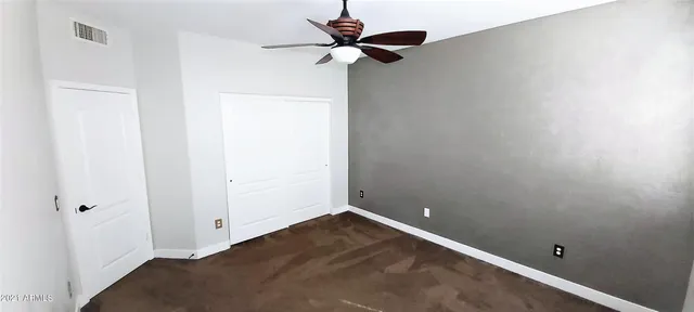 a view of entryway with a chandelier fan
