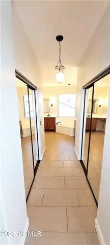 a view of walk in closet with white walls