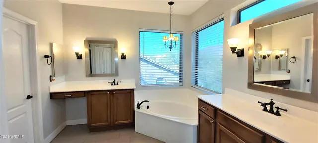 a bathroom with a toilet a sink and a mirror