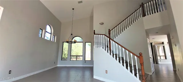 a view of an entryway and wooden floor