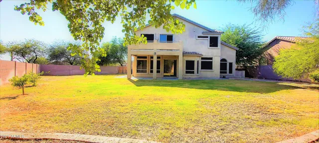 a view of house with yard