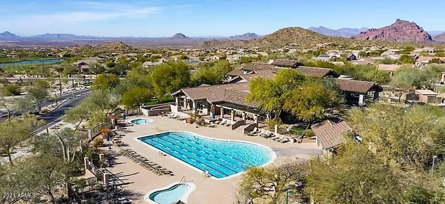 a view of a backyard with sitting area