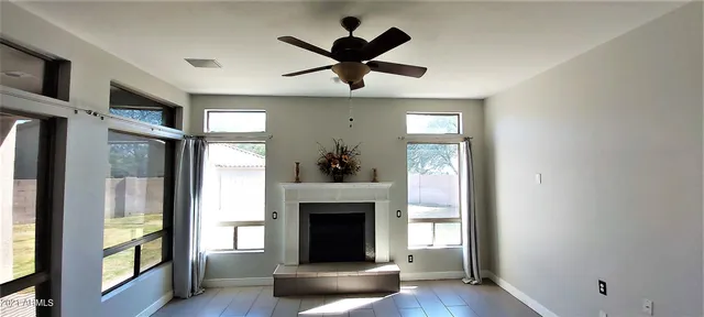 a view of kitchen with furniture and a ceiling fan