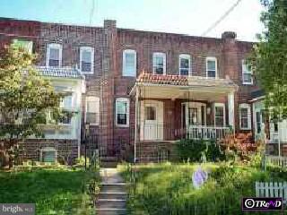 1312 S South Merrimac Road Camden, NJ 08104 - Photo 1 of 1 a front view of a residential apartment building with a yard