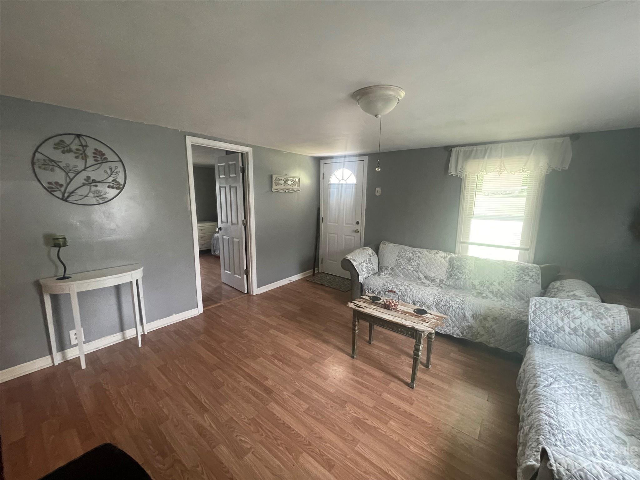 150 Raby Street Canton, NC 28716 - Photo 11 of 38 a living room with furniture and a table
