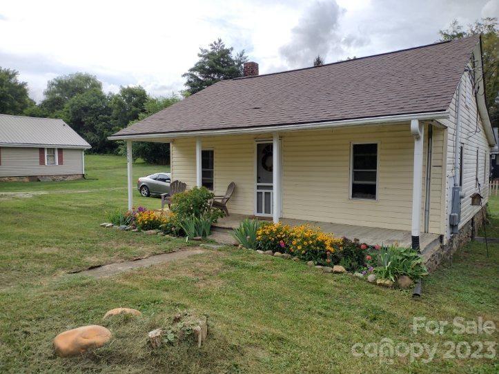 150 Raby Street Canton, NC 28716 - Photo 3 of 38 a front view of a house with garden
