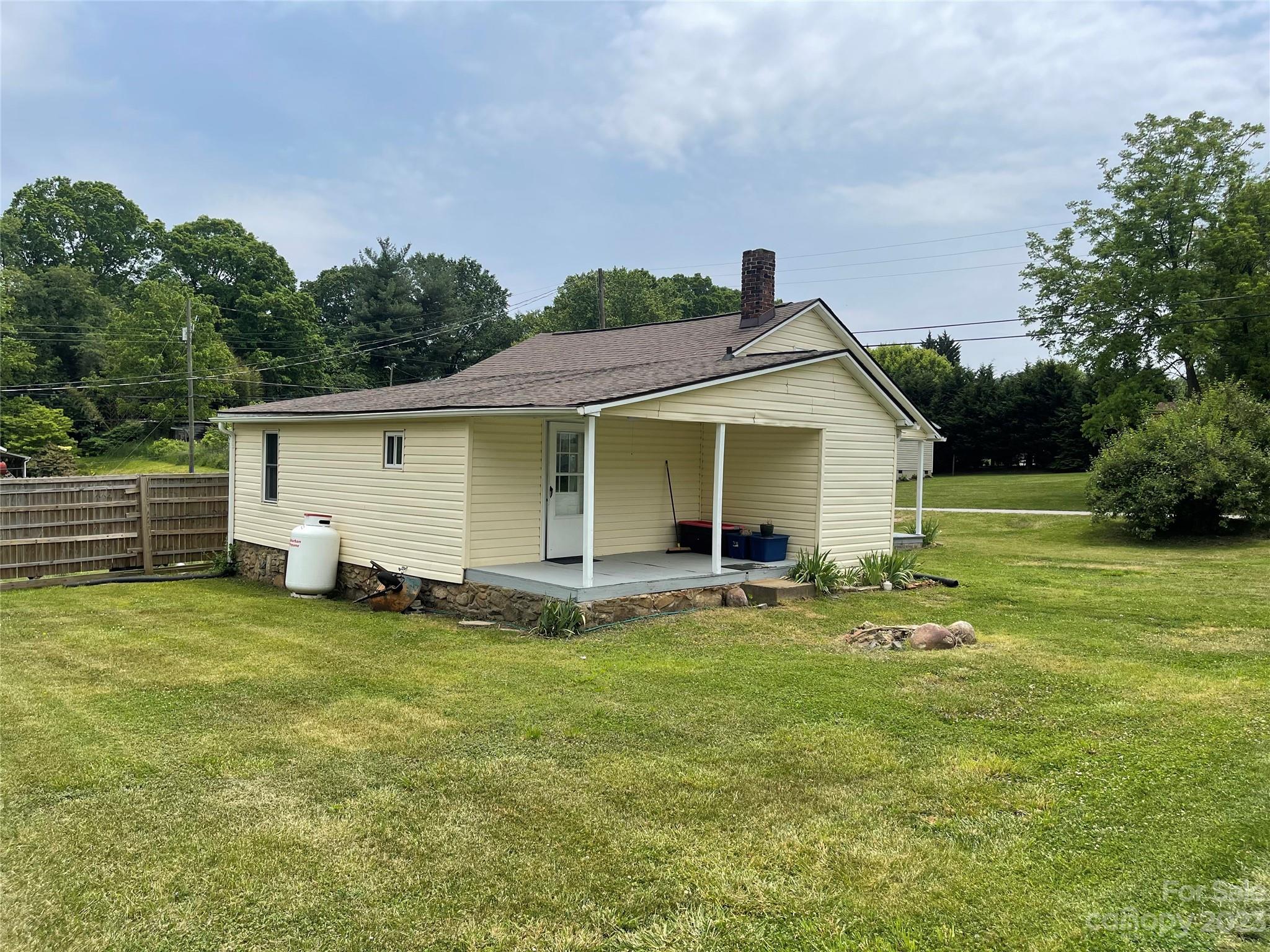 150 Raby Street Canton, NC 28716 - Photo 34 of 38 a view of a house with a yard