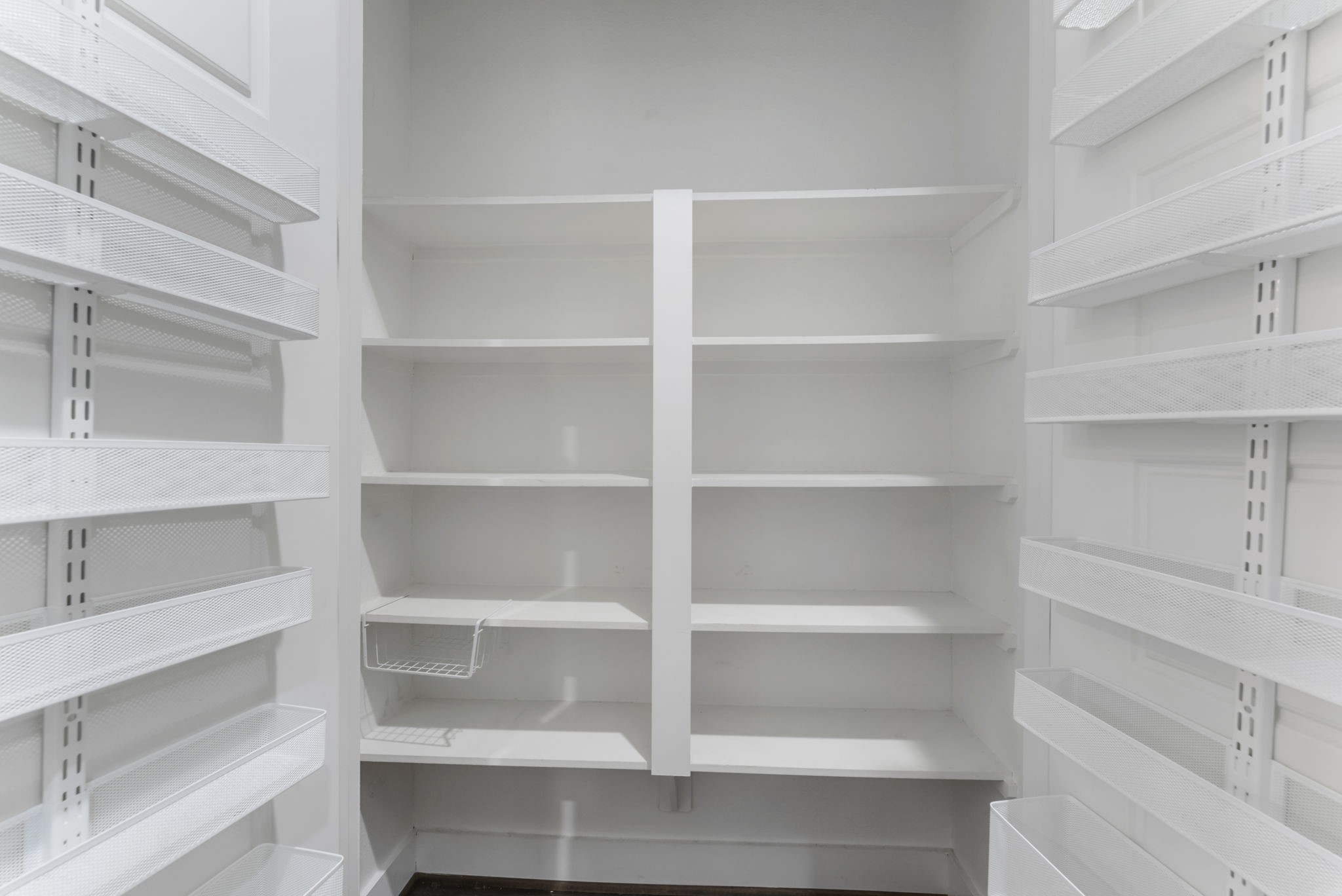 113 Coronado Street Houston, TX 77009 - Photo 11 of 39 a view of walk in closet with empty racks