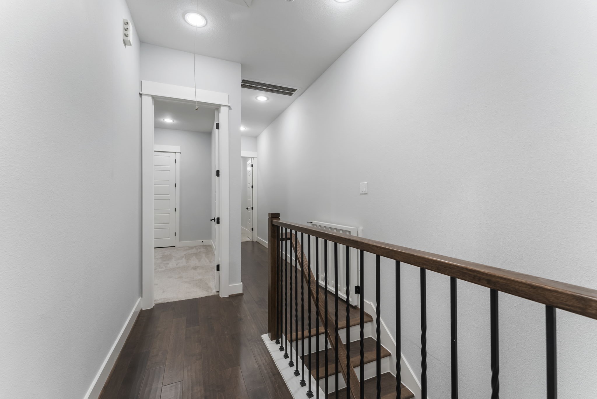 113 Coronado Street Houston, TX 77009 - Photo 17 of 39 a view of a hallway with wooden floor and a bathroom