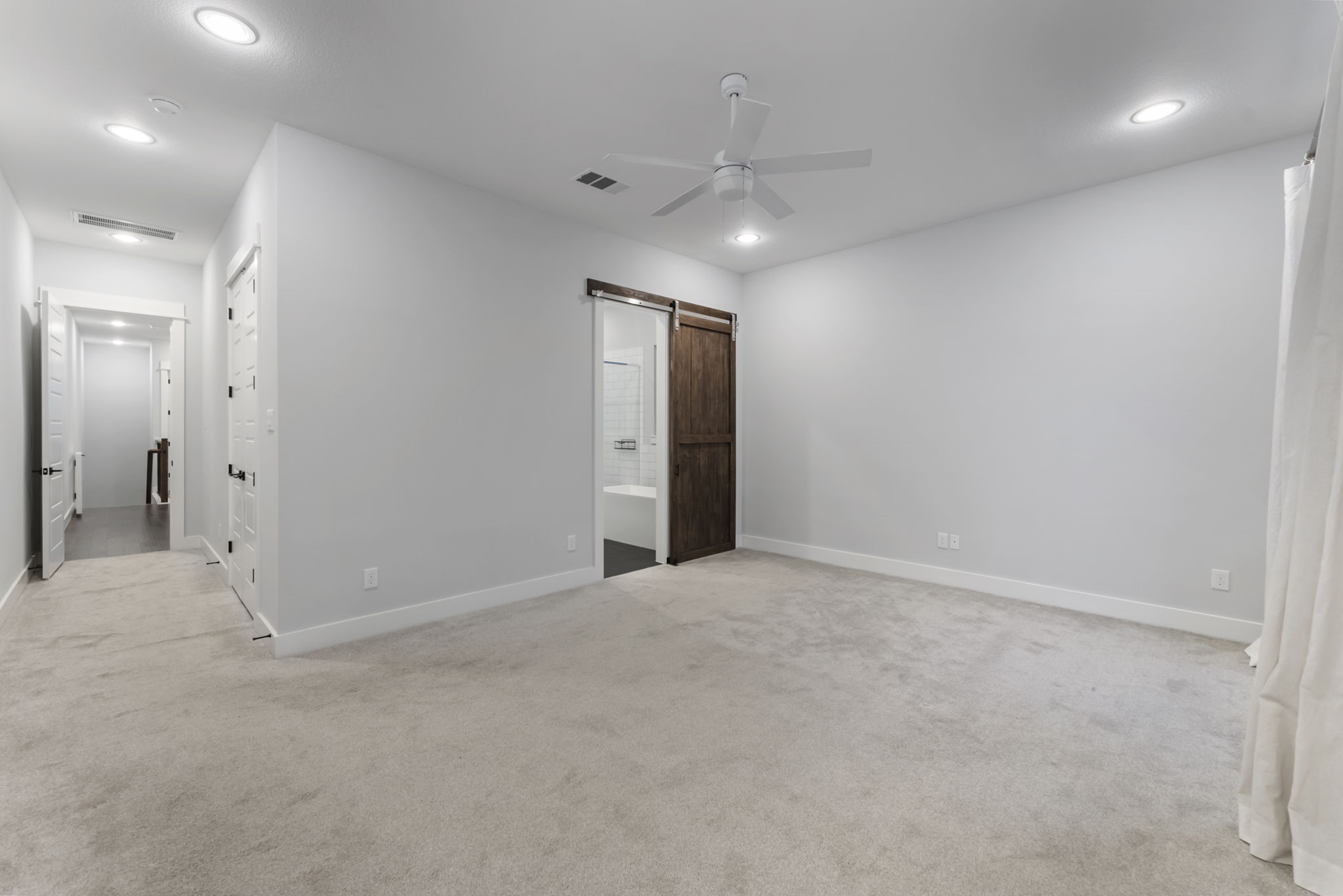 113 Coronado Street Houston, TX 77009 - Photo 19 of 39 an empty room with closet and a chandelier fan