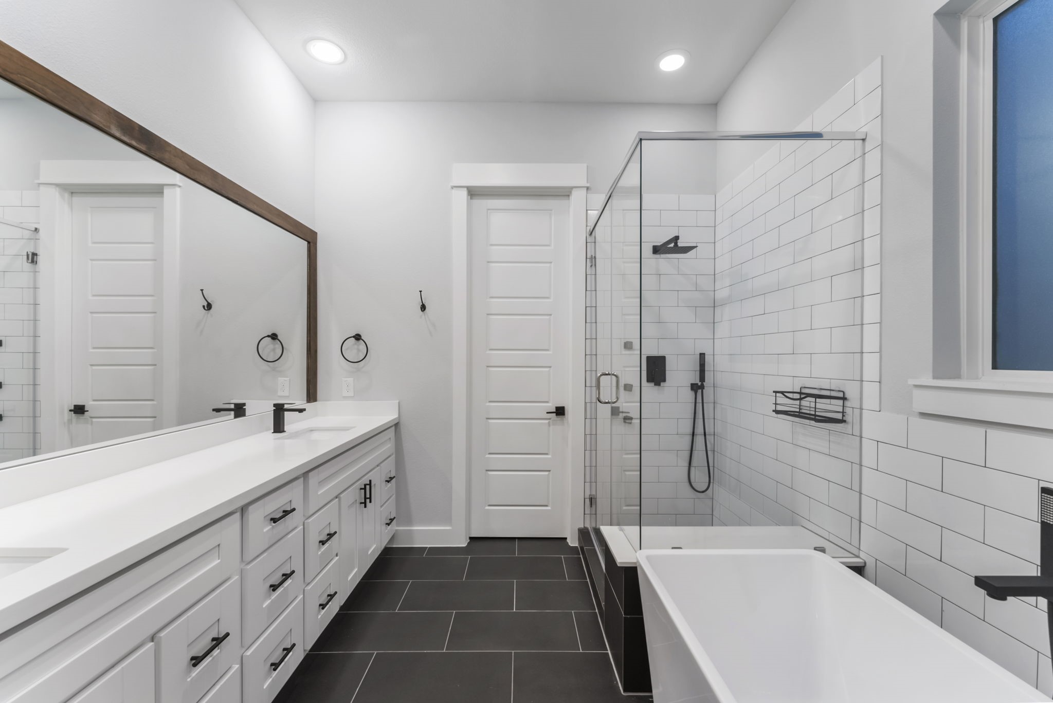 113 Coronado Street Houston, TX 77009 - Photo 22 of 39 a bathroom with a double vanity sink mirror double and bathtub