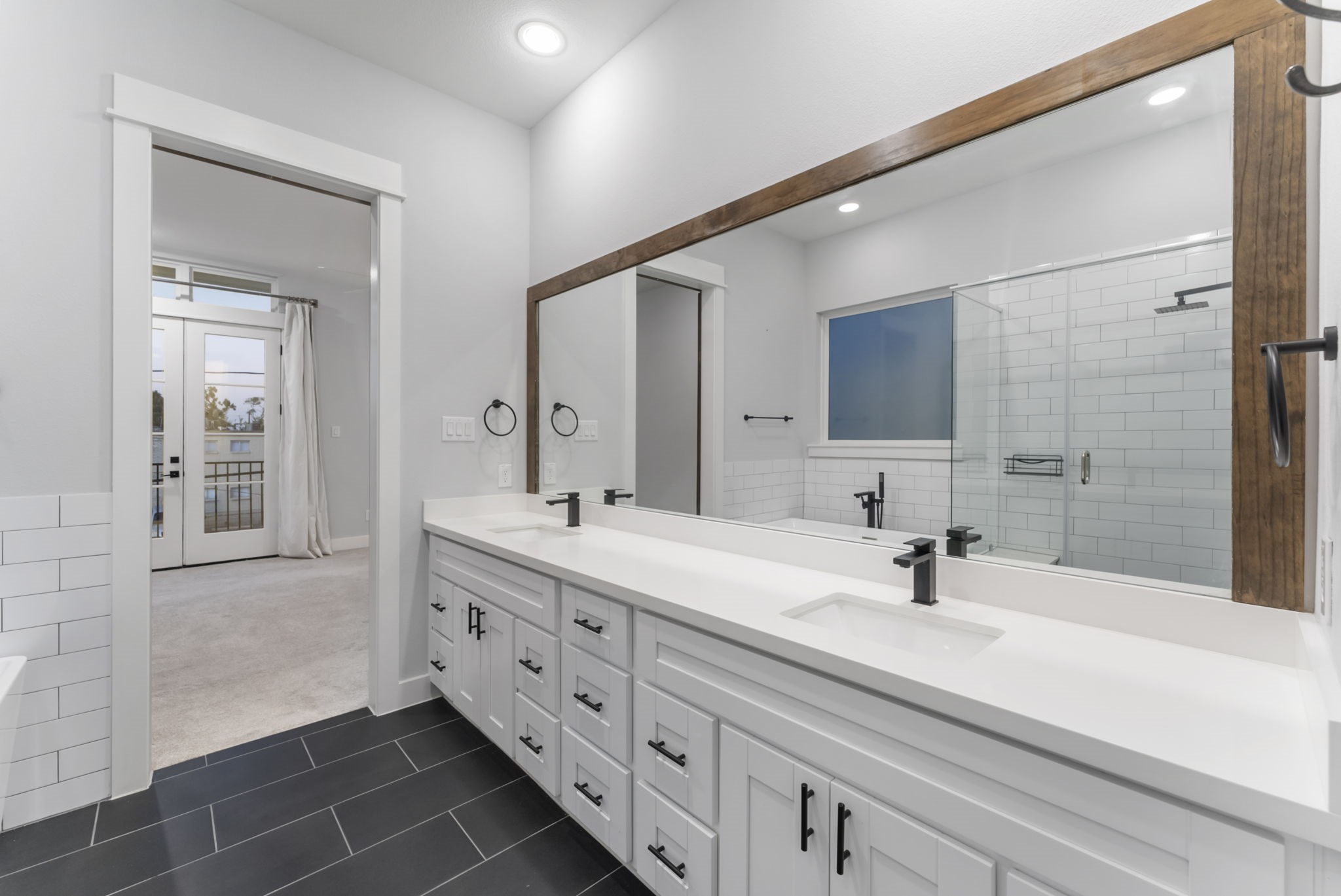 113 Coronado Street Houston, TX 77009 - Photo 25 of 39 a bathroom with a double vanity sink mirror and shower