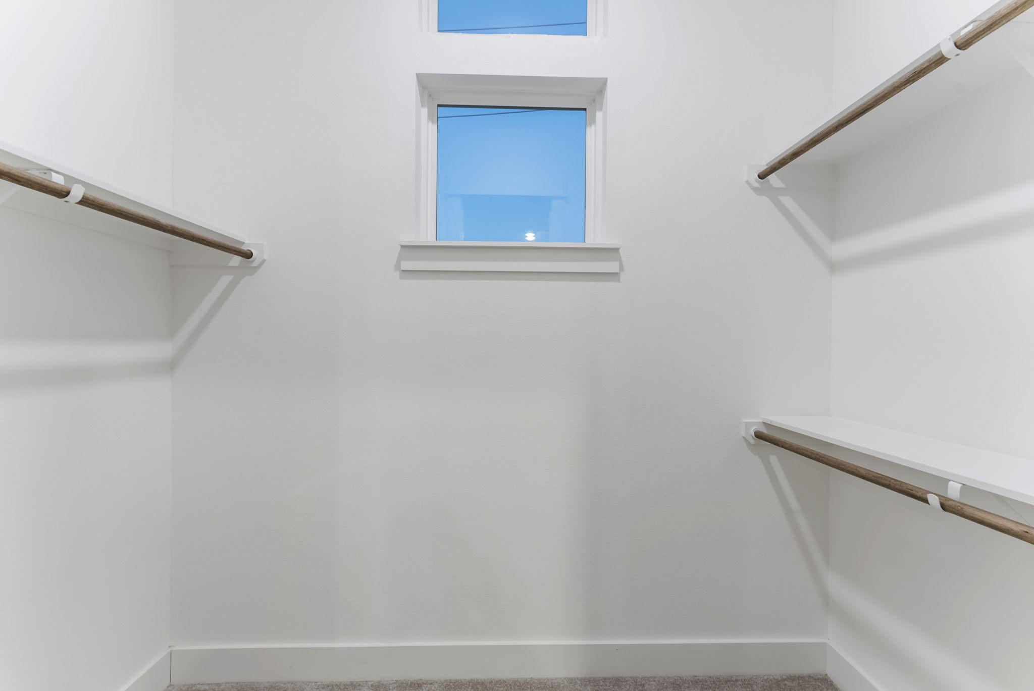 113 Coronado Street Houston, TX 77009 - Photo 28 of 39 a view of a closet area with empty racks