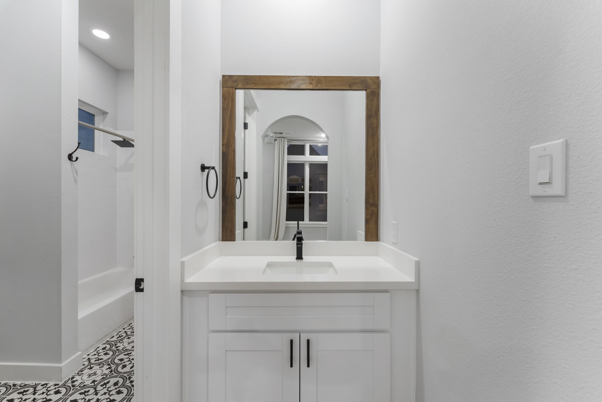 113 Coronado Street Houston, TX 77009 - Photo 31 of 39 a bathroom with a sink and a mirror