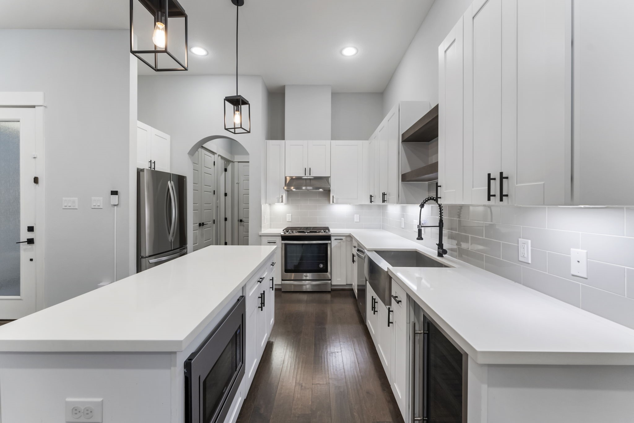113 Coronado Street Houston, TX 77009 - Photo 4 of 39 a kitchen with a sink a counter top space a stove and a refrigerator