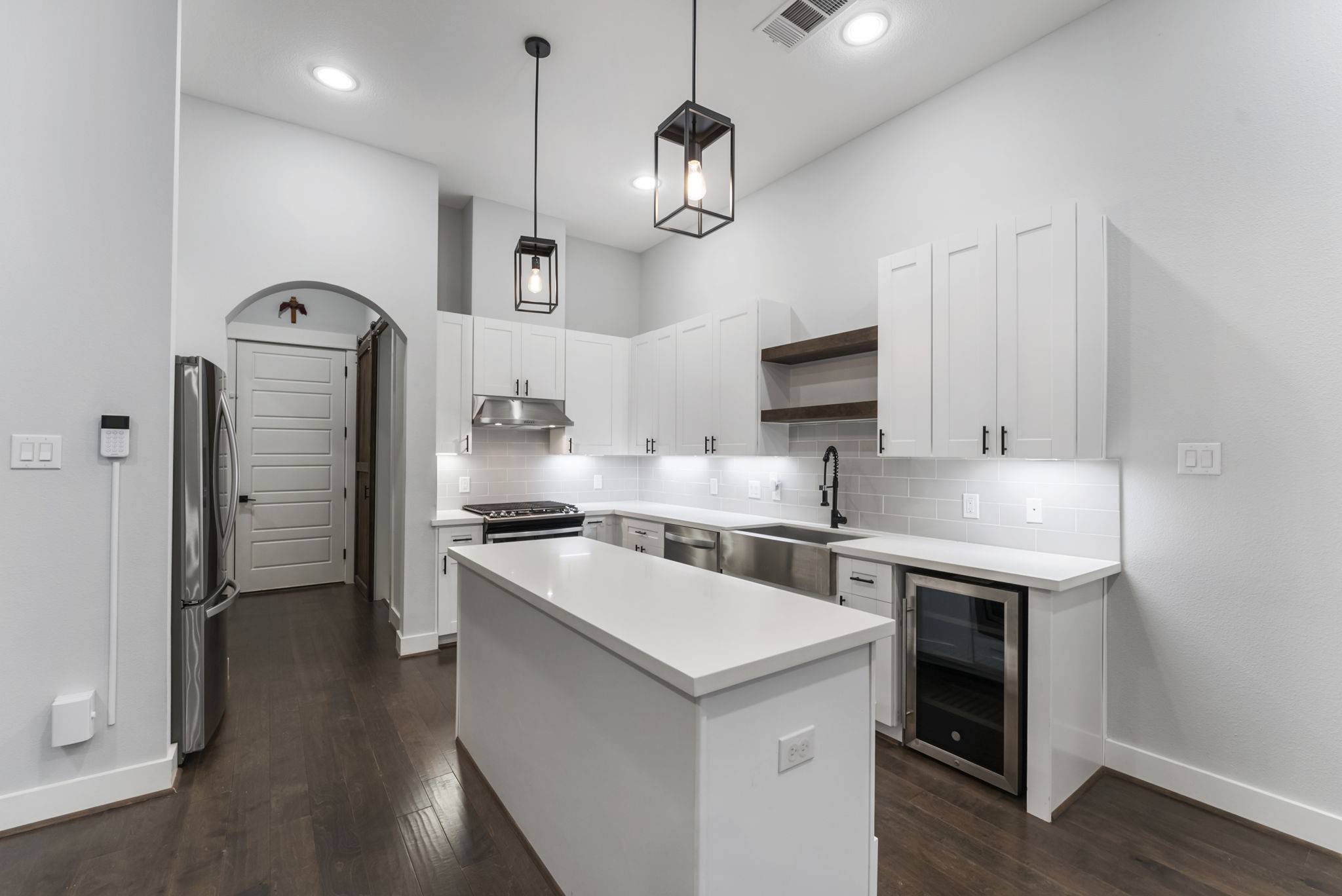 113 Coronado Street Houston, TX 77009 - Photo 5 of 39 a kitchen with a stove a sink and a refrigerator