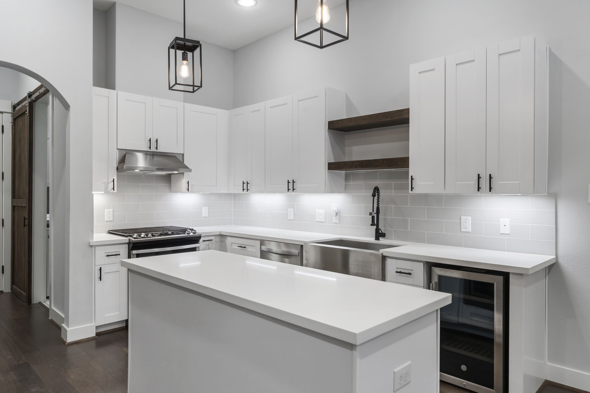 113 Coronado Street Houston, TX 77009 - Photo 6 of 39 a kitchen with stainless steel appliances a sink stove and refrigerator