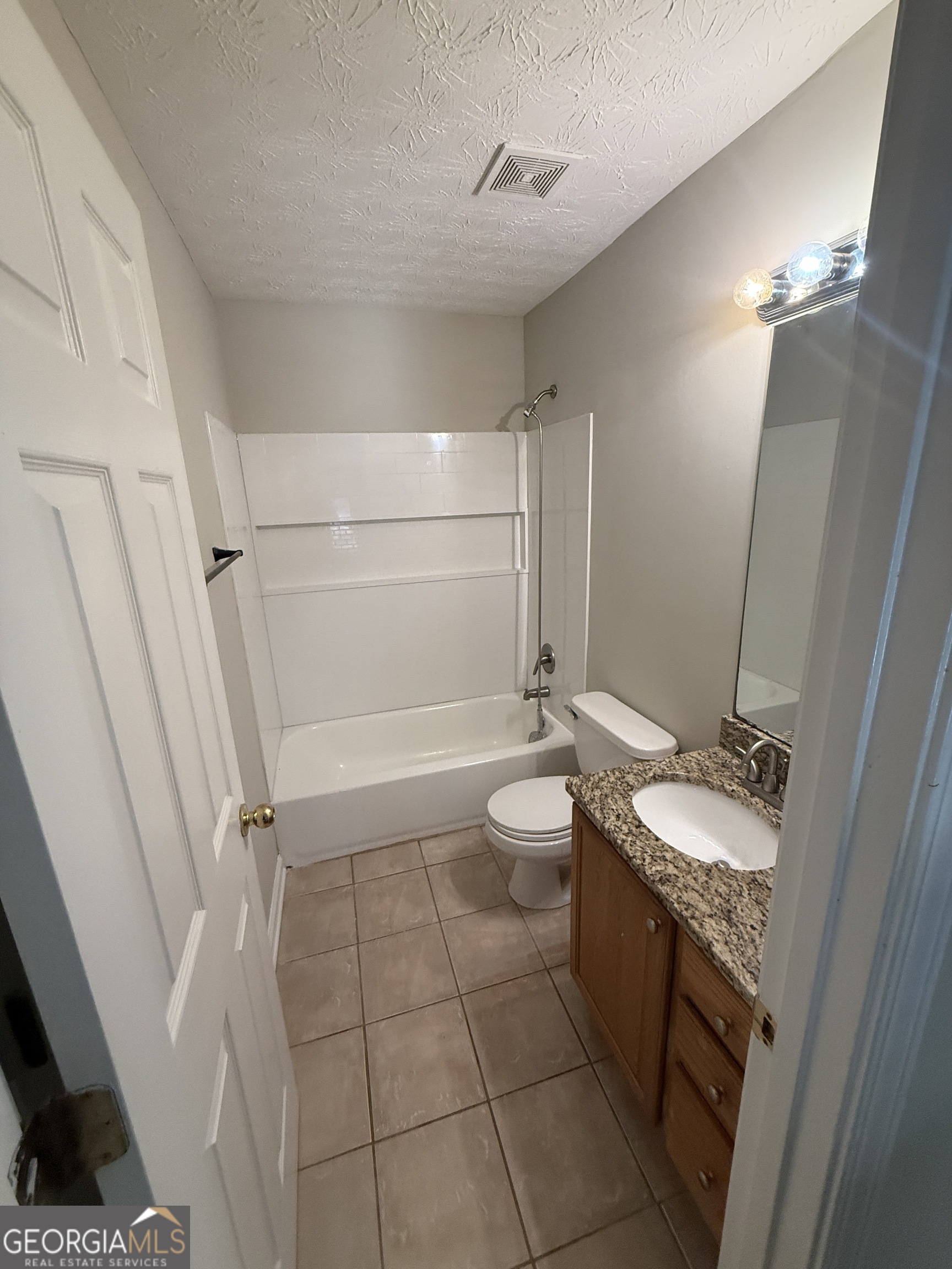 27 Montgomery Street Northeast Atlanta, GA 30307 - Photo 15 of 25 a bathroom with a sink a toilet and shower