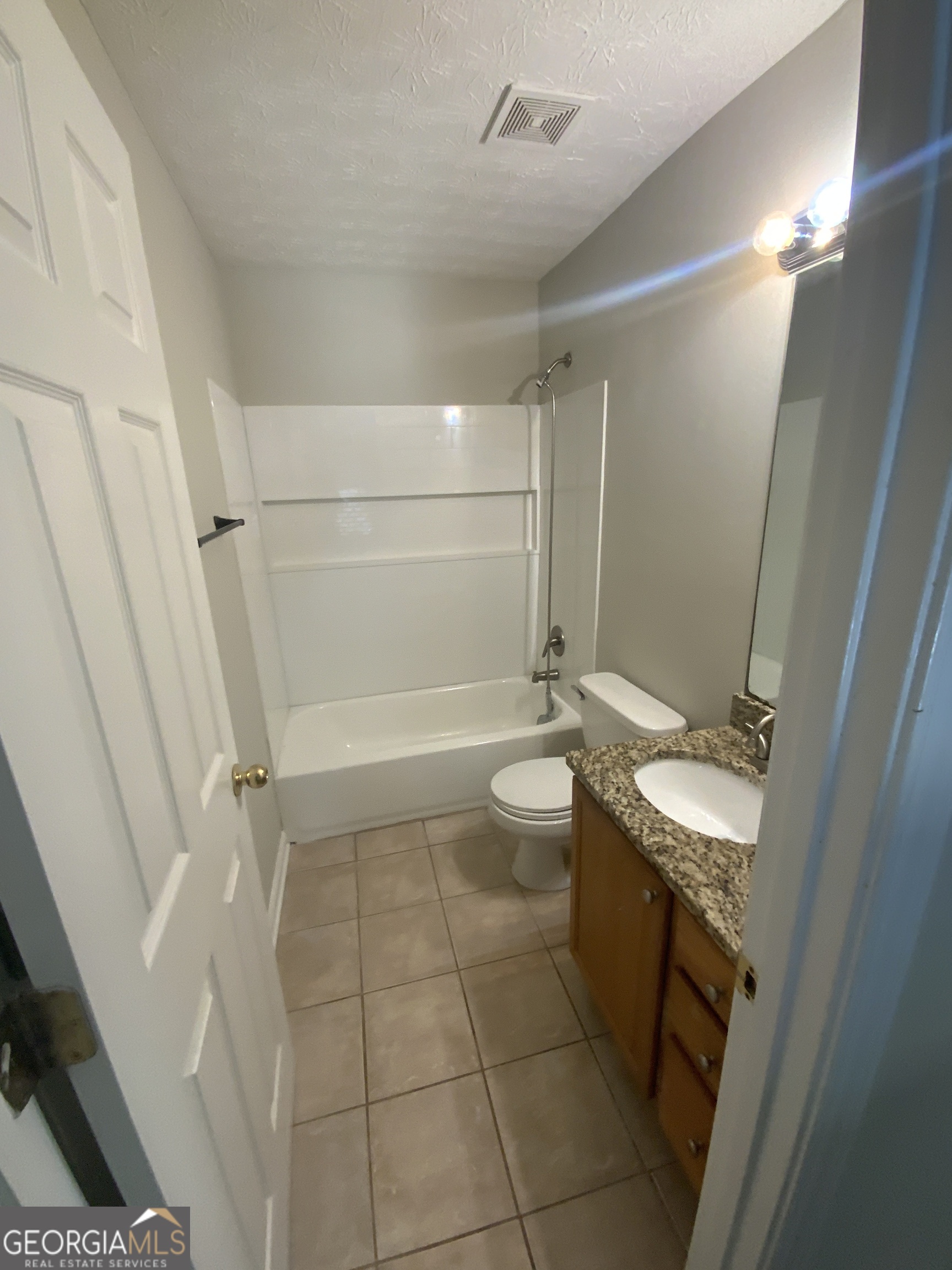 27 Montgomery Street Northeast Atlanta, GA 30307 - Photo 20 of 25 a bathroom with a sink a toilet and shower