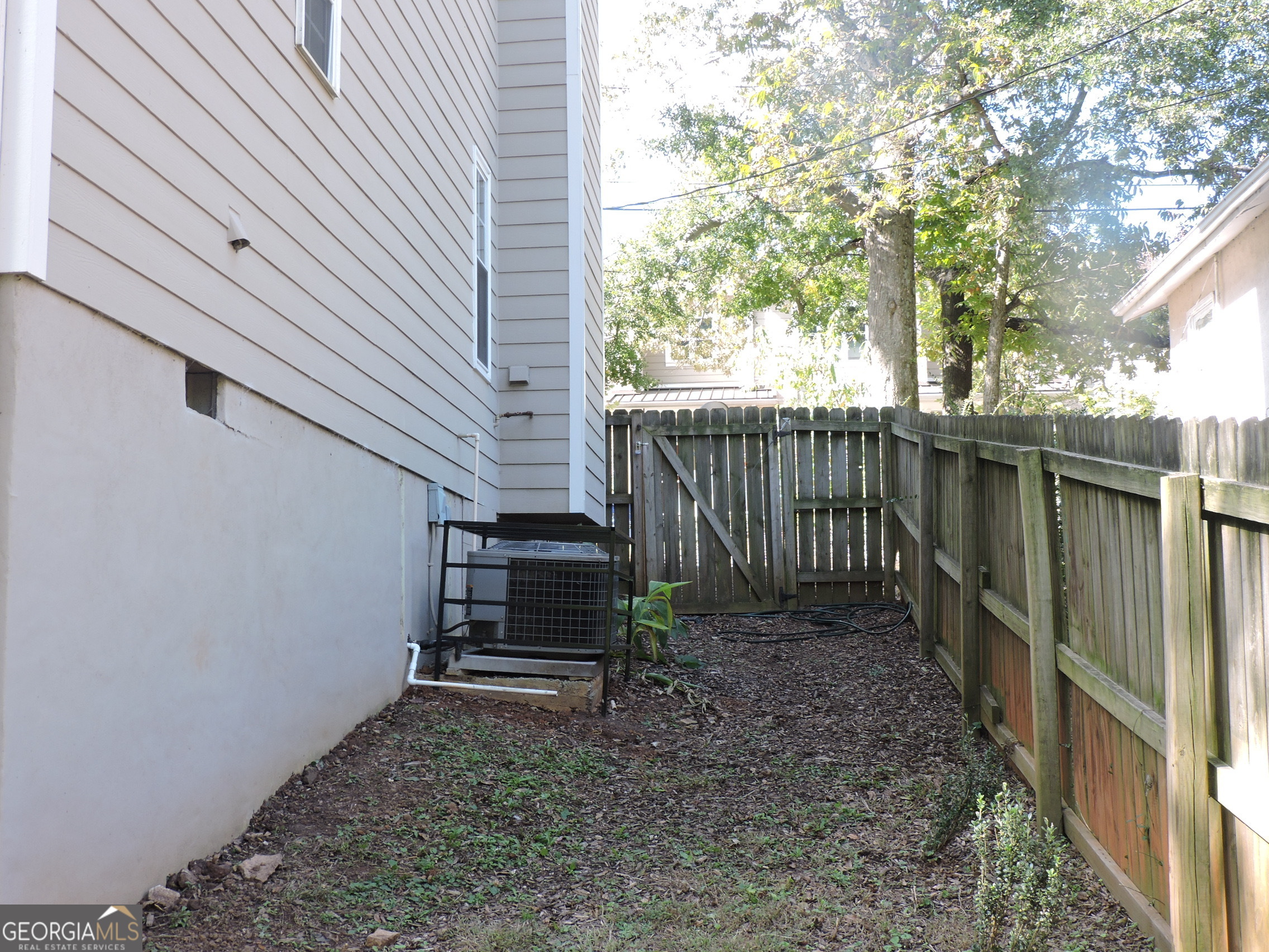 27 Montgomery Street Northeast Atlanta, GA 30307 - Photo 22 of 25 a view of a house with backyard and wooden fence