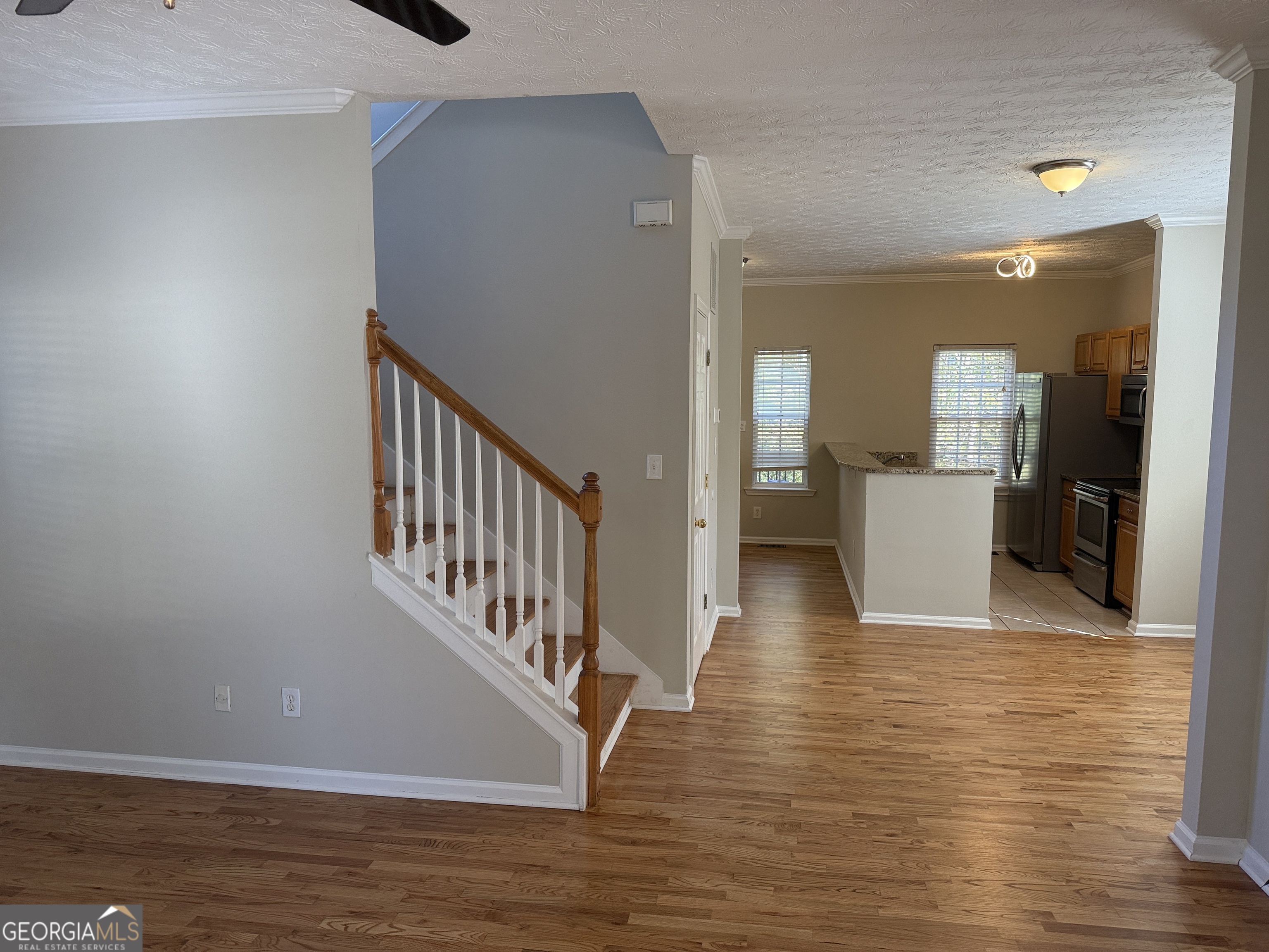 27 Montgomery Street Northeast Atlanta, GA 30307 - Photo 7 of 25 a view of a hallway with wooden floor and staircase