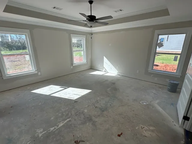 a view of an empty room with a window